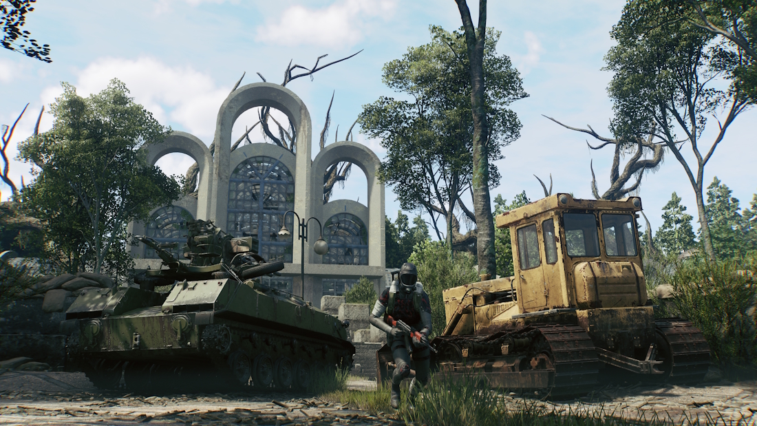 The Park greenhouse has tall concrete arches above large glazed windows, behind an armored vehicle and a yellow bulldozer.
